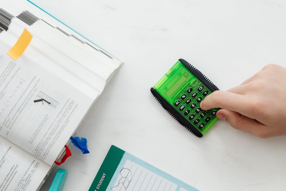 A calculator and dollar bills representing retirement savings.