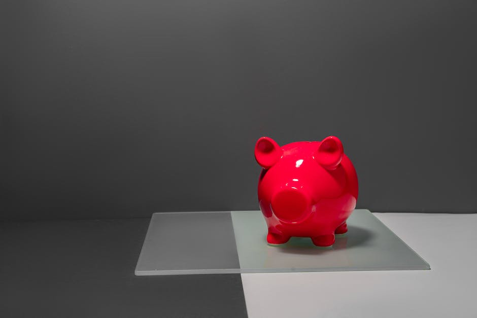 A person holding a piggy bank with dollar signs on it, representing high IRA rates and maximizing retirement savings.